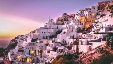 white concrete houses on hill during daytime