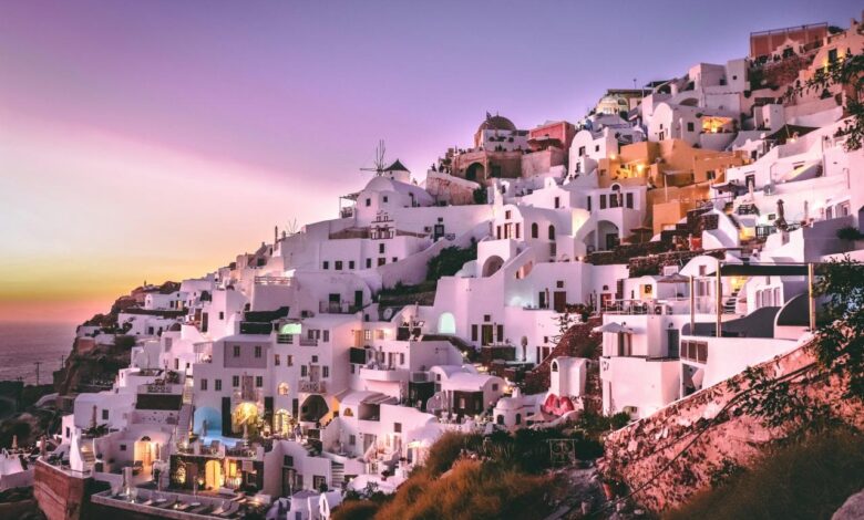 white concrete houses on hill during daytime