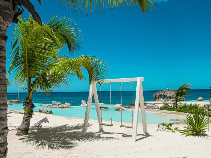 swing bench near swimming pool